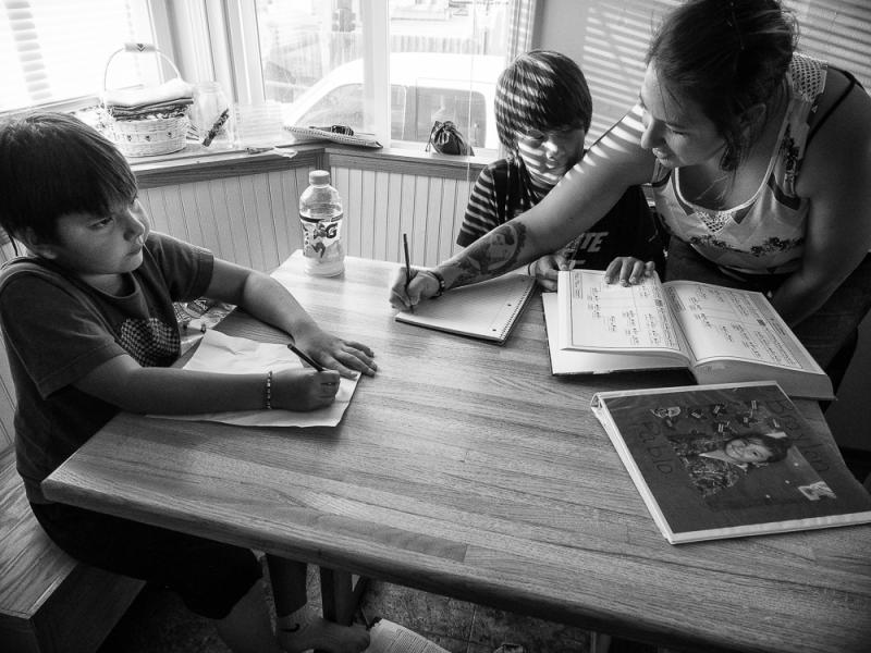 Nicole Pablo Helping Her Sons with Homework Polson Flathead Reservation Montana, 2016 by Sue Reynolds