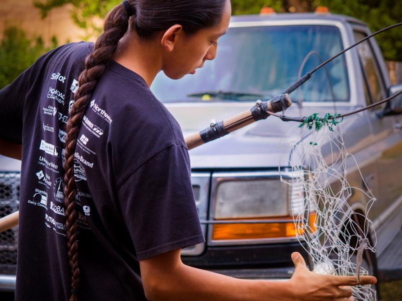 Tiyapo Campbell with a River Fishing Net, Nez Perce Reservation, Idaho, 2017 by Sue Reynolds